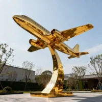 Large Golden Airplane Sculpture