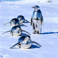 Metal Crawling Penguin Sculpture For Sale