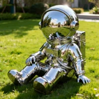 Cute Cartoon Sitting Metal Spaceman Sculpture