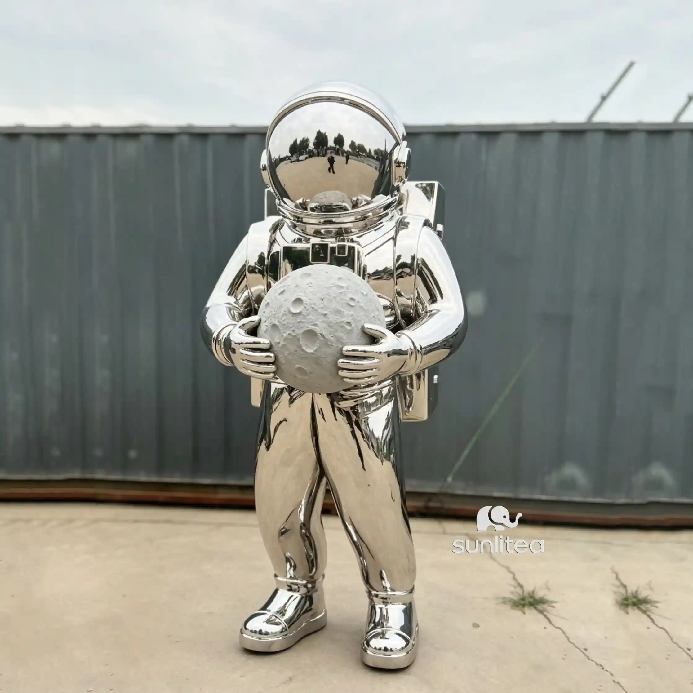 Astronaut Holding Moon Statue